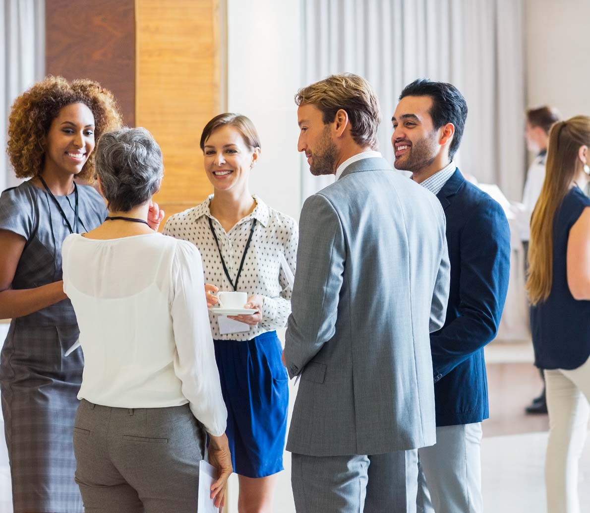 Mountain North Coaching And Consulting group of business people talking at a conference