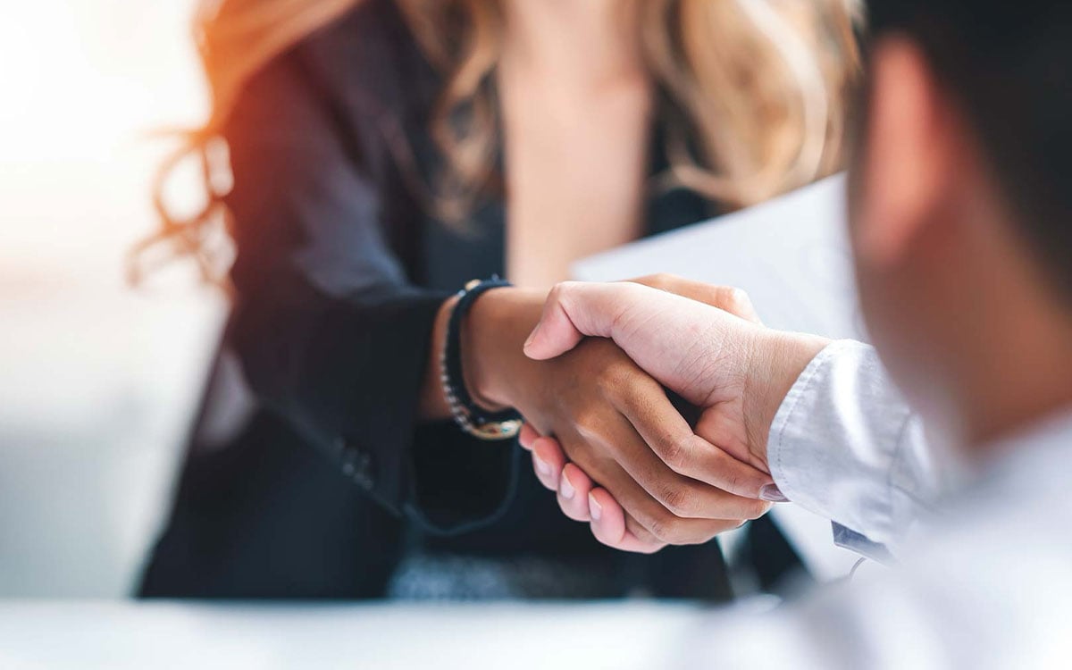 Talent Management and Employment Selection – Mountain North Coaching and Consulting business person shaking hands with another business person